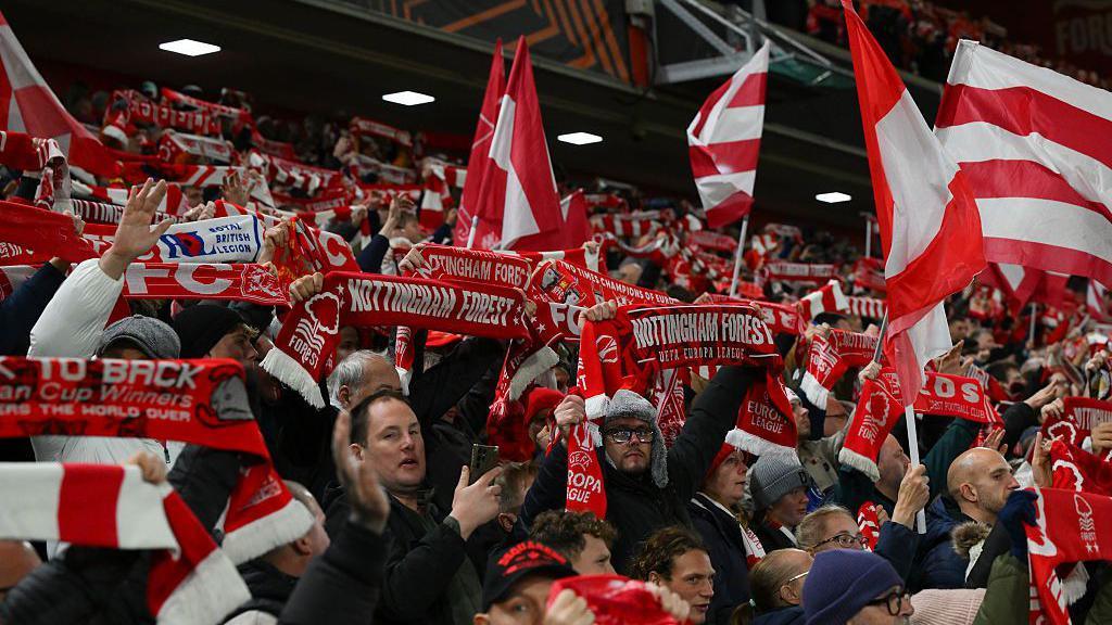 Nottingham Forest supporters hold scarves and flags prior to their Europa League match