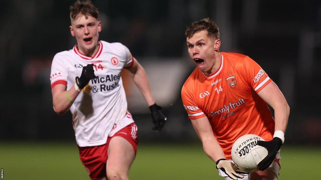 Tyrone's Lorcan McGarrity attempts to keep pace with Armagh's Oisin O'Neill at the Athletic Grounds