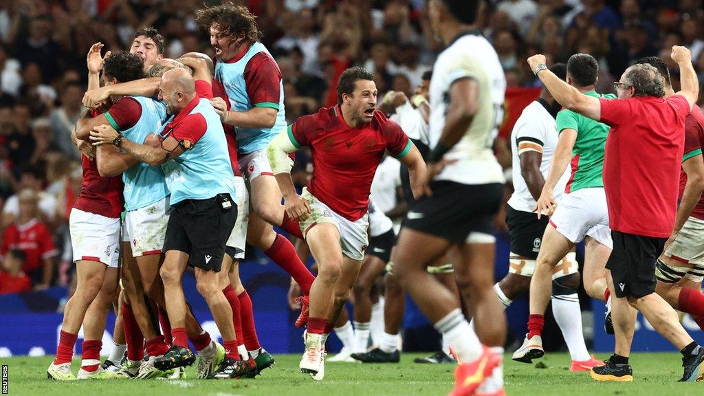 Portugal celebrate their victory over Fiji