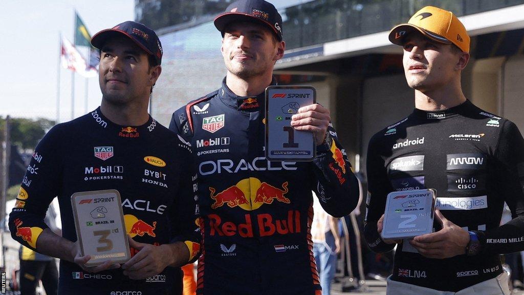 The top three of Sergio Perez, Max Verstappen and Lando Norris pose with their medals after the Sao Paulo Grand Prix sprint race