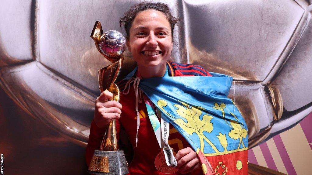 Ivana Andres holds up the World Cup trophy