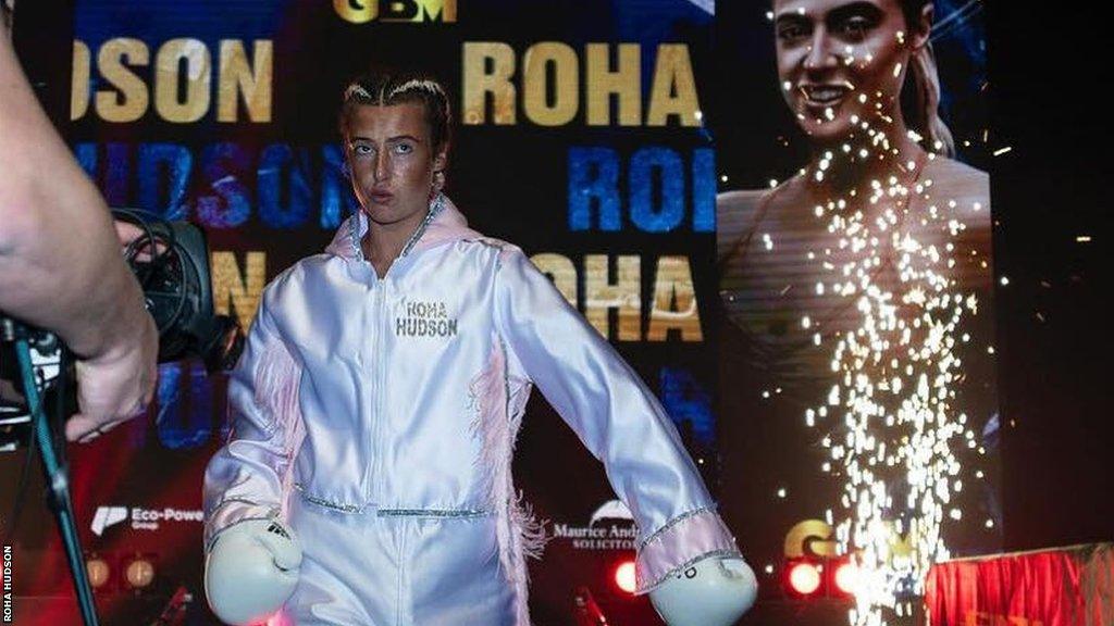 Roha Hudson making her ring walk ahead of her first professional fight