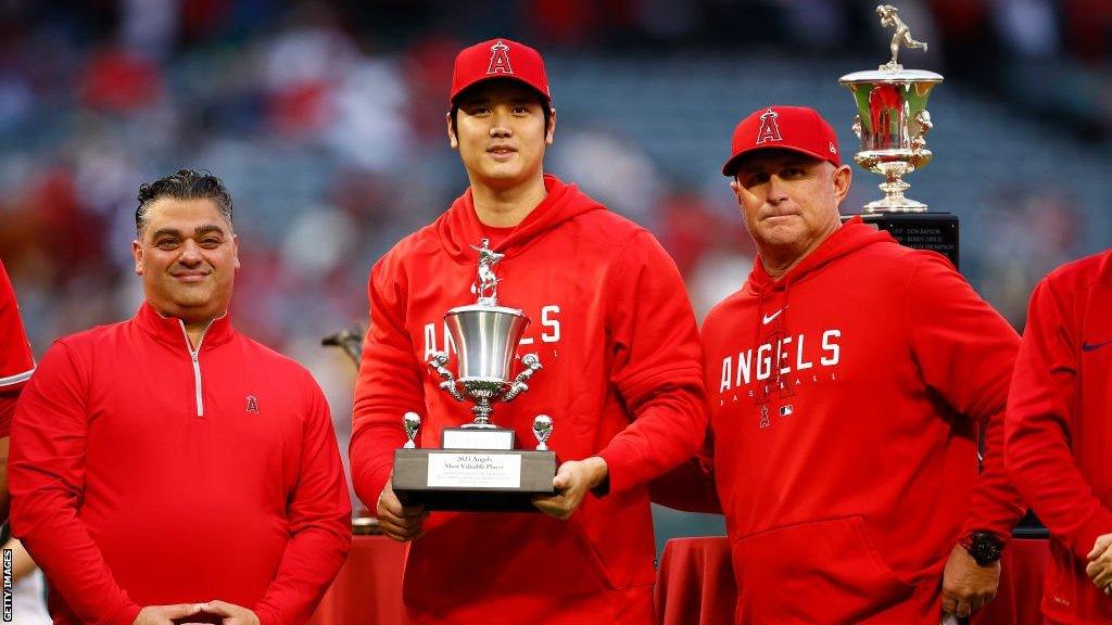 General Manager Perry Minasian (left), Shohei Ohtani (centre) of the Los Angeles Angels and Angels head coach Phil Nevin (right)