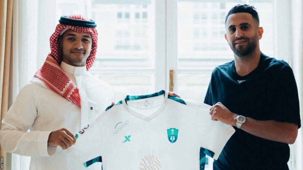 New signing Riyad Mahrez with Al-Ahli's executive director Yazin Al-Sharif