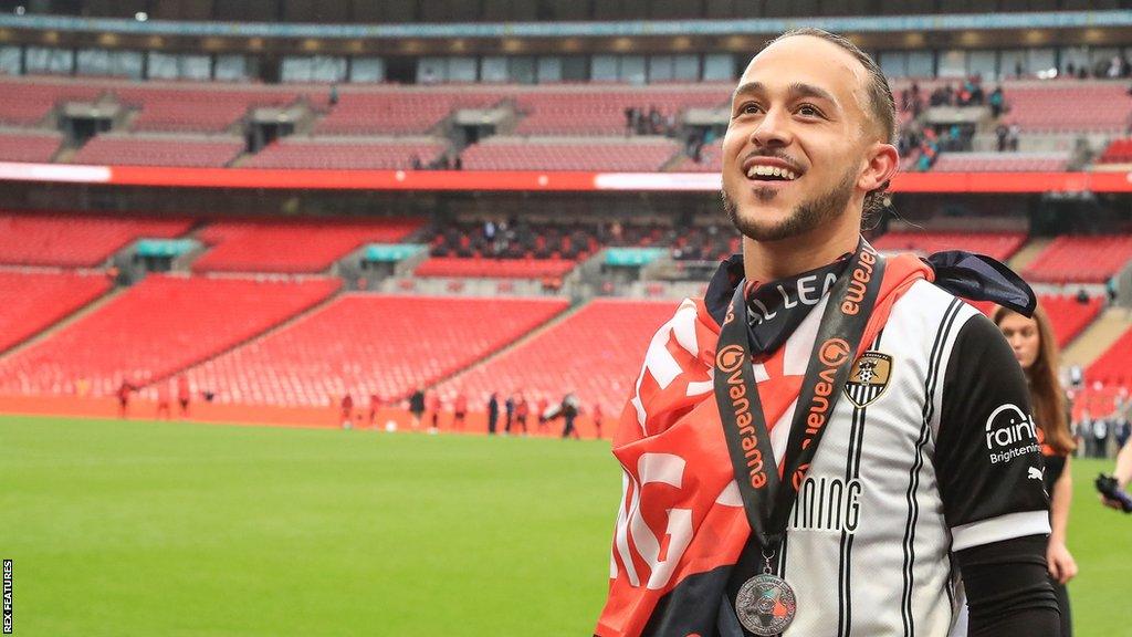 Jodi Jones with a National League promotion final winners medal around his neck at Wembley