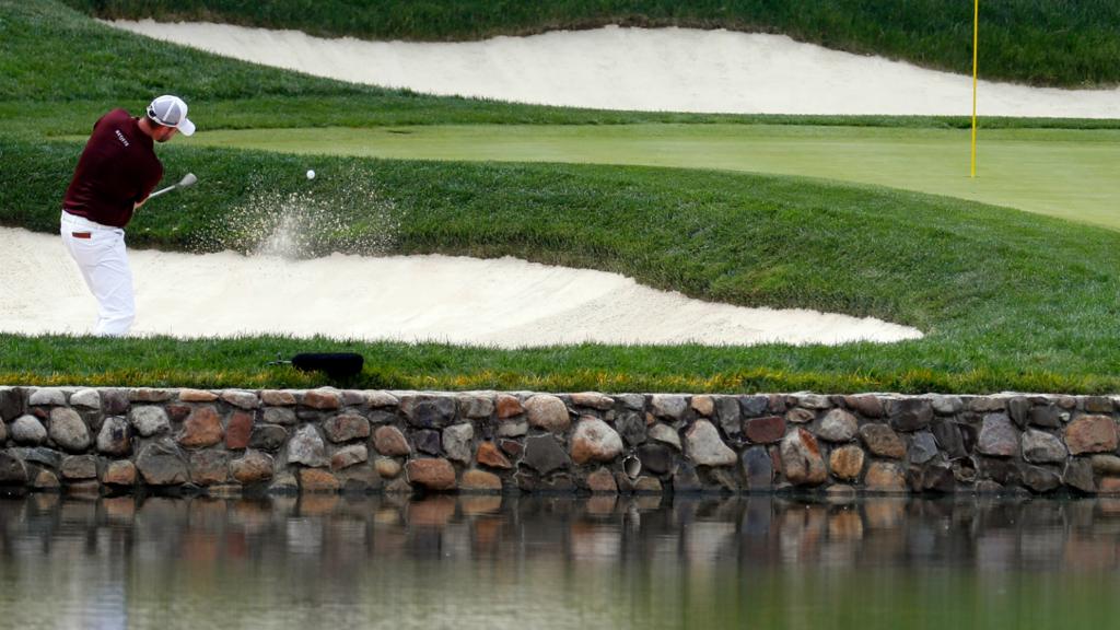 Mark Leishman plays a shot from the bunker