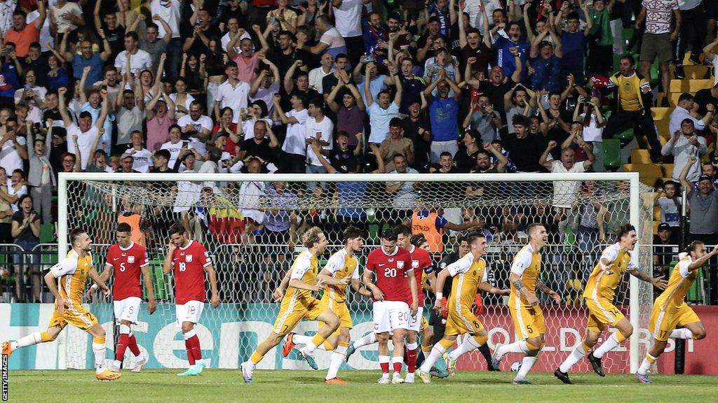 Moldova celebrate their win over Poland