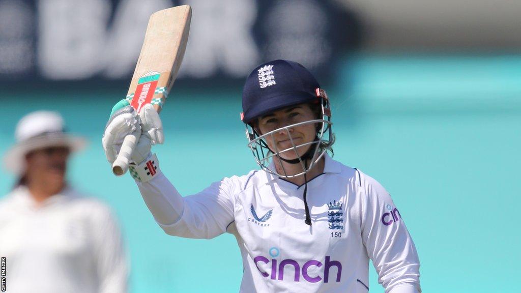 Tammy Beaumont of England Women celebrates reaching her century during the tour match between England Women and Australia A Women at The Incora County Ground on June 16, 2023 in Derby, England.