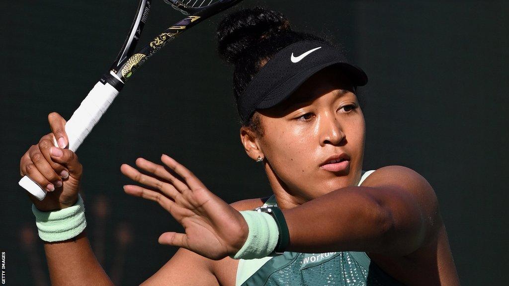 Naomi Osaka hits a forehand