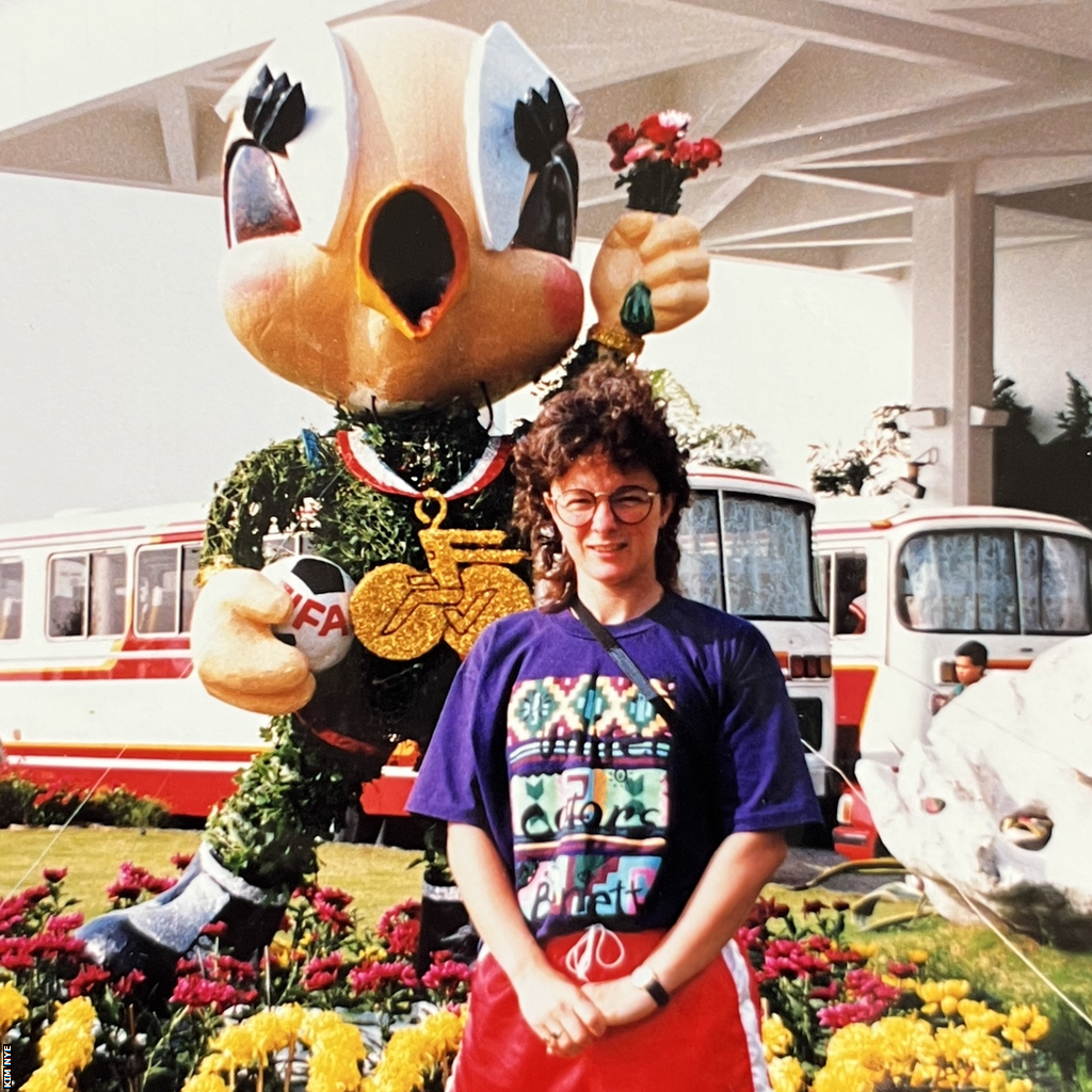 Kim Nye outside the luxury White Swan hotel with official tournament mascot Ling Ling