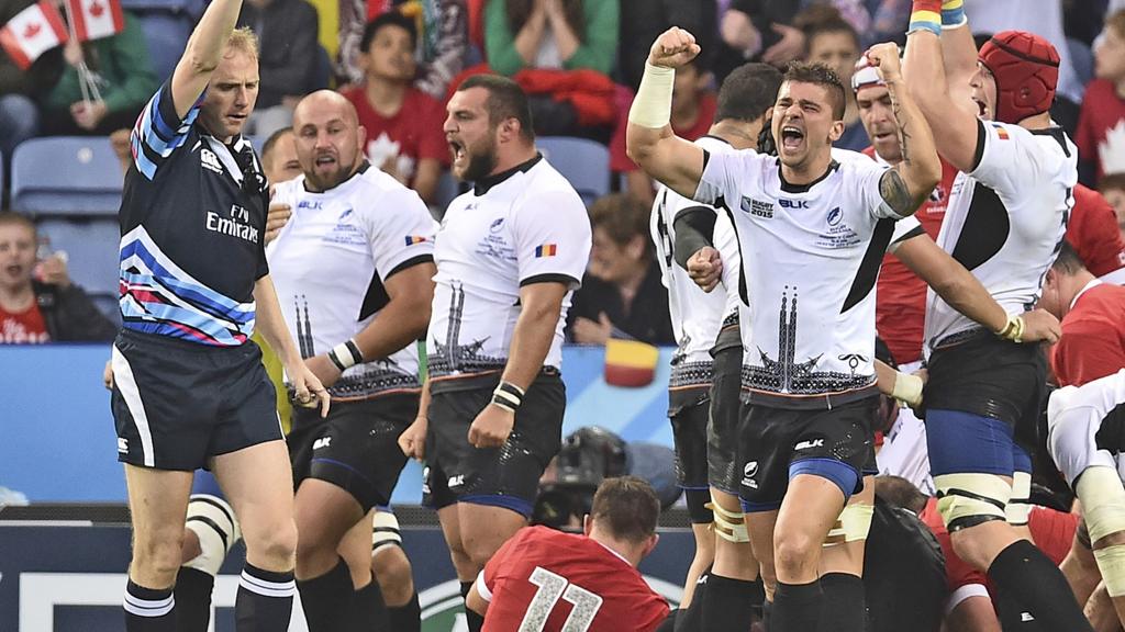 Romania players celebrate