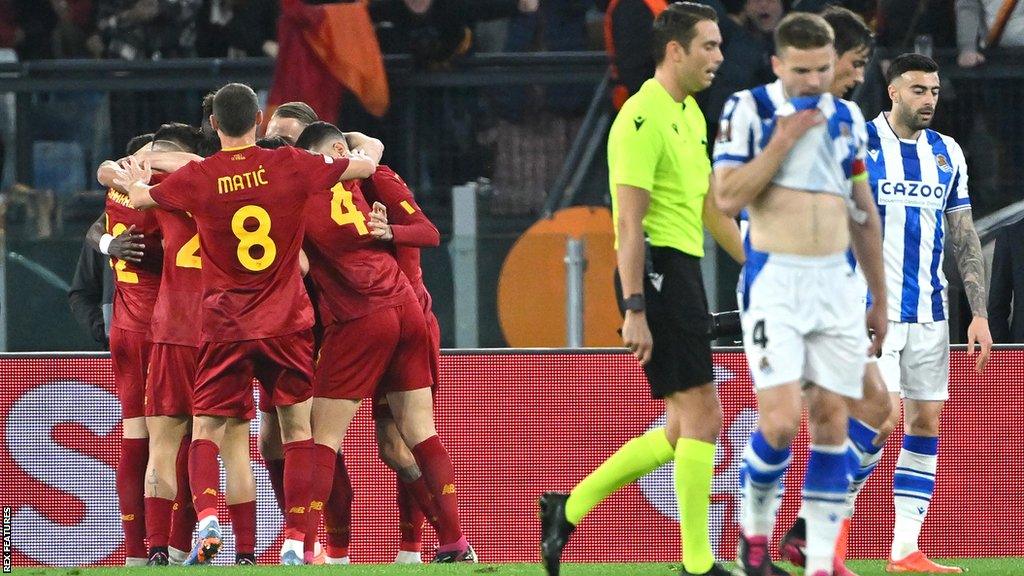 Roma's players celebrate after scoring against Real Sociedad in the Europa League