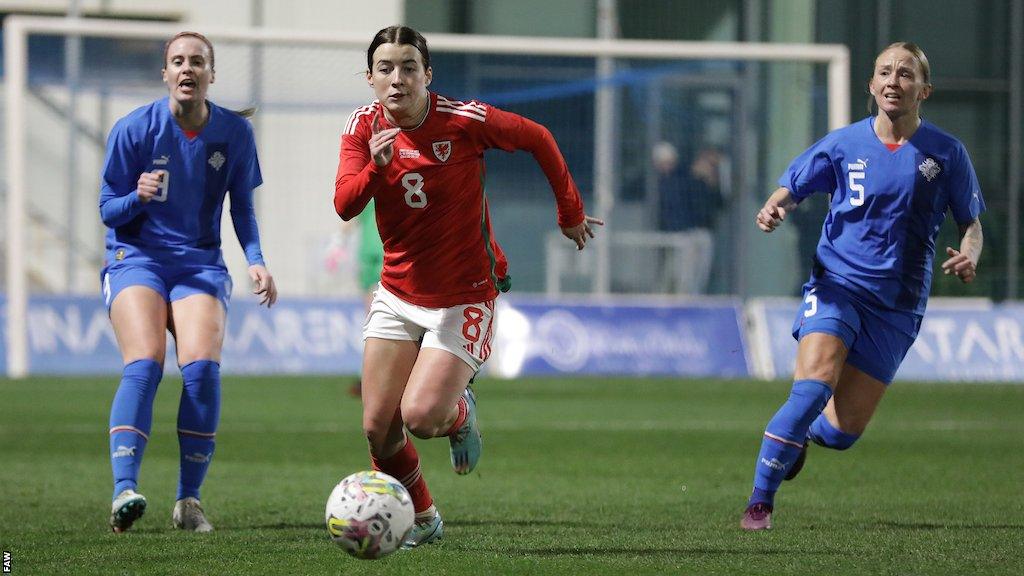 Angharad James chases down loose ball against Iceland