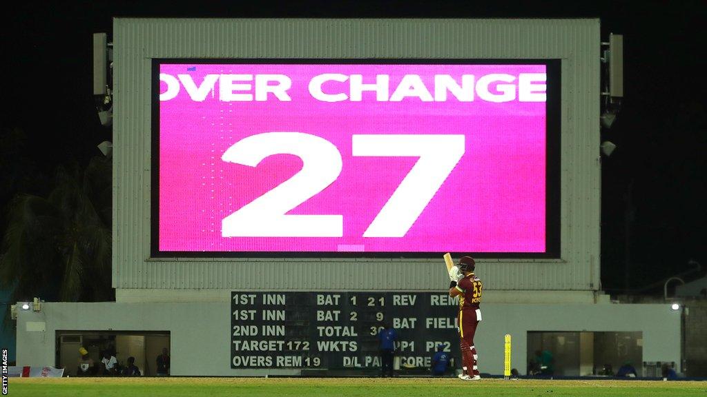 A stop-clock displays the fielding side have 27 seconds to start the next over during a T20 international between West Indies and England