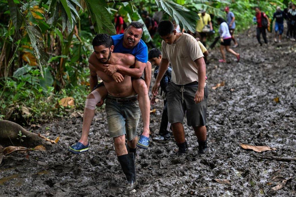 A Venezuelan family heads to the Temporary Housing Center for Migrants San Antonio Casa Esperanza after walking for weeks in order to cross into Colombia and continue their journey to the United States, in San Antonio del Tachira, Venezuela, on September 25, 2022.