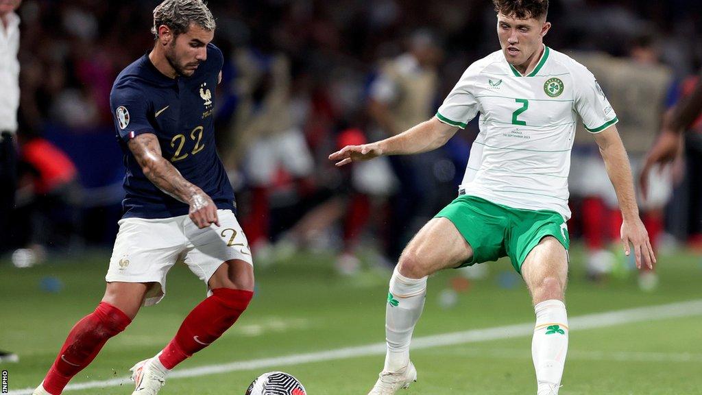 Dara O'Shea attempts to challenge France's Theo Hernandez during the game in Paris two months ago