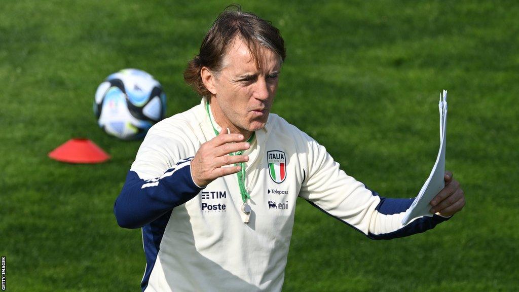 Roberto Mancini gives instructions to his players during a training session