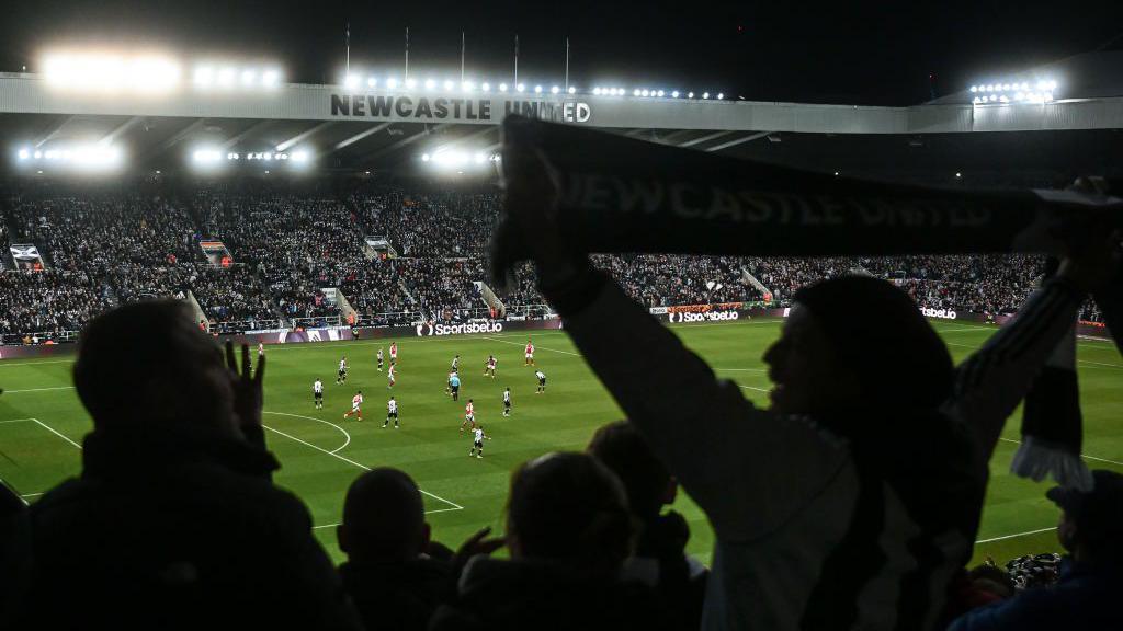 A view of play as Newcastle fans sing during the Carabao Cup semi-final second leg match between Newcastle United and Arsenal at St James' Park.