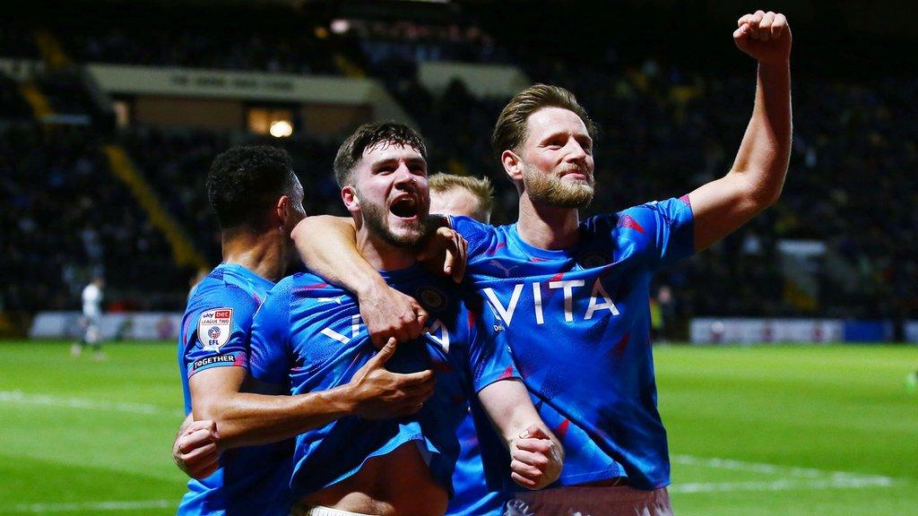 Ethan Pye celebrates scoring a goal against Notts County