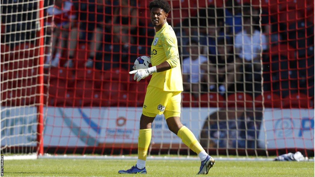 Salford City have signed goalkeeper Giosue Bellagambi on loan from Championship side Huddersfield Town for the rest of the season.