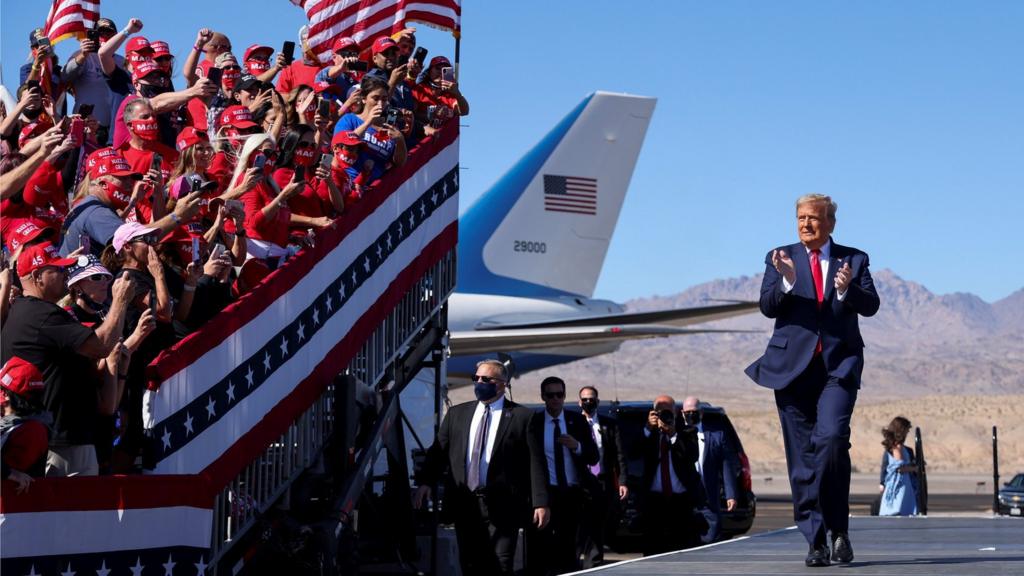 U.S. President Donald Trump applauds as he arrives for a campaign rally at Laughlin/Bullhead International Airport in Bullhead City, Arizona, U.S., October 28, 2020