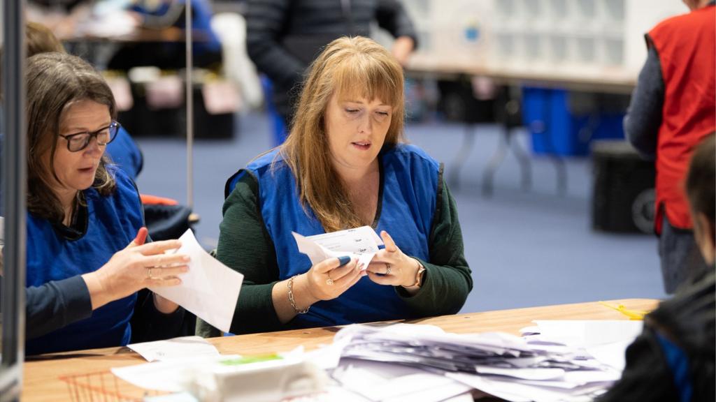 Woman at count desk