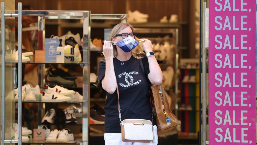 Woman with mask on Buchanan St, Glasgow