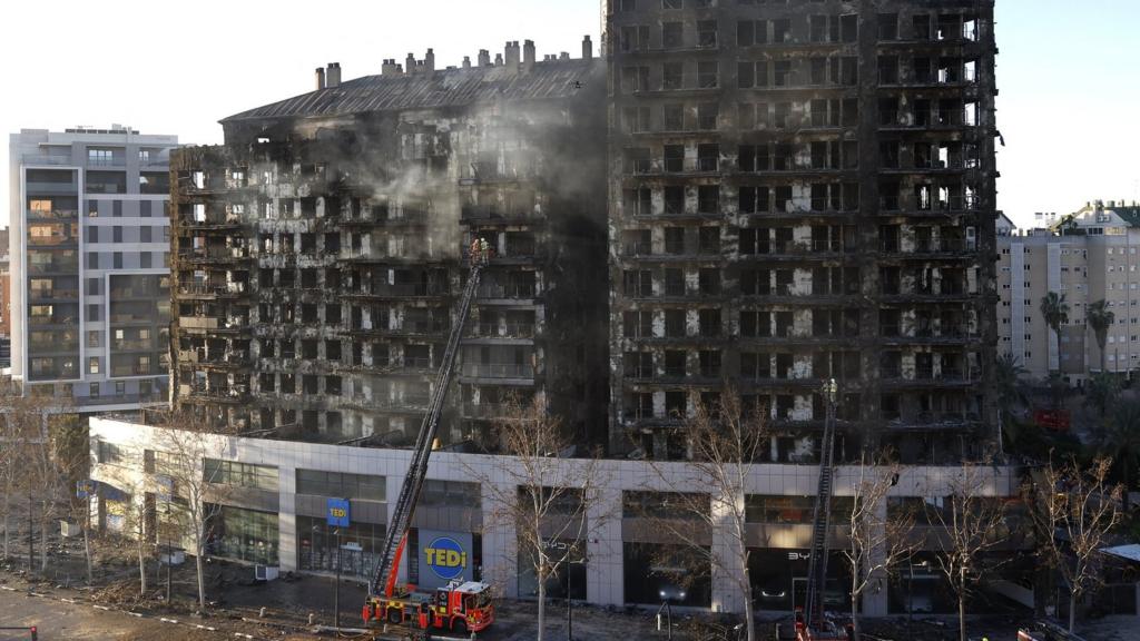 The blackened shell of the tower blocks that were set on fire in Valencia, pictured the day after the blaze