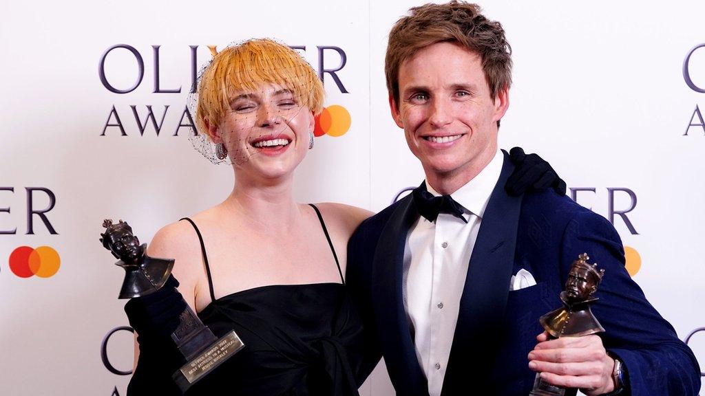 Jessie Buckley and Eddie Redmayne with their Olivier awards