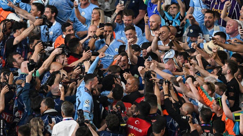 Phil Foden celebrates with Manchester City fans after beating Inter Milan in the Champions League final