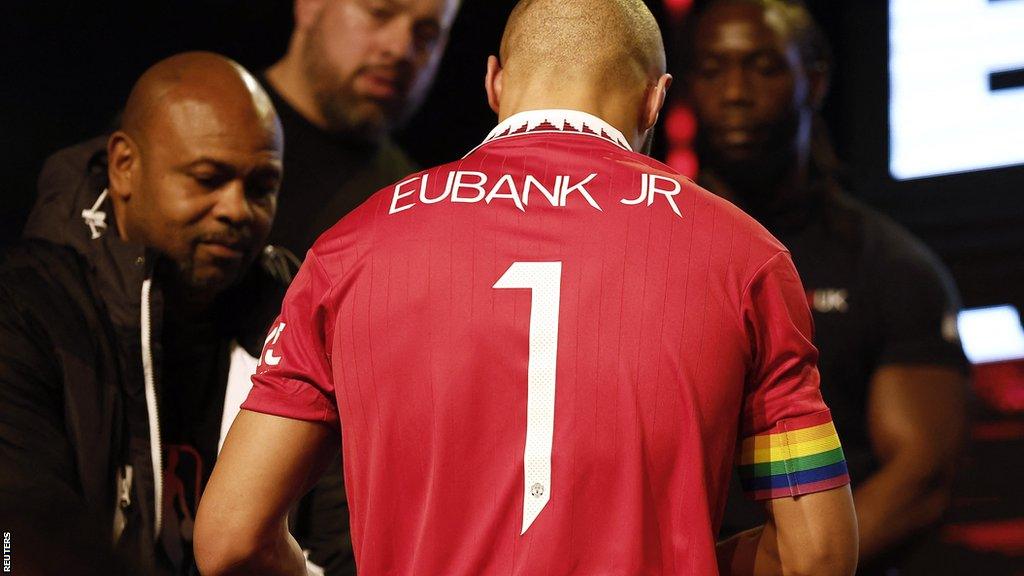 Picture of the back of Chris Eubank's Manchester United shirt with a rainbow armband