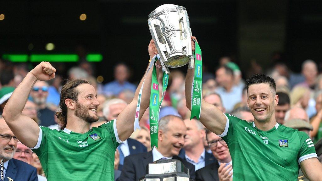 Limerick's Dan Morrissey and Tom Morrissey lift the Liam MacCarthy Cup in 2022