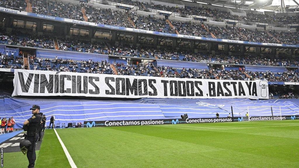 Real Madrid fans hold up a banner saying “Vinicius we are all. Enough already"