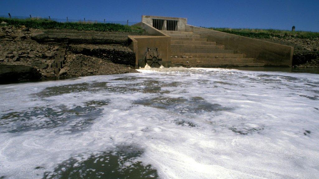 Sewage discharge into a river