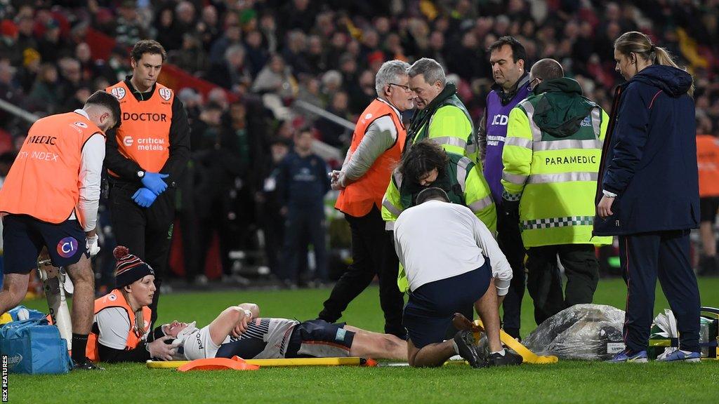 Tom Woolstencroft was carried off after Adam Coleman's shoulder made contact with his head