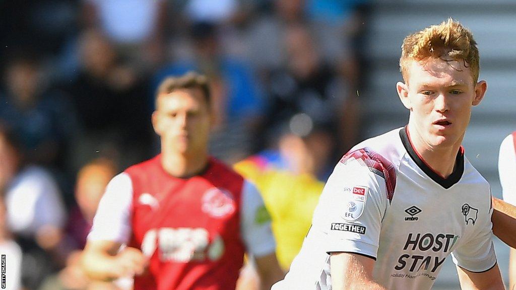 Jake Rooney watches the ball while in action for Derby