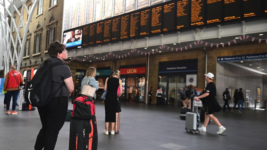 Traveller at King's Cross Station, London