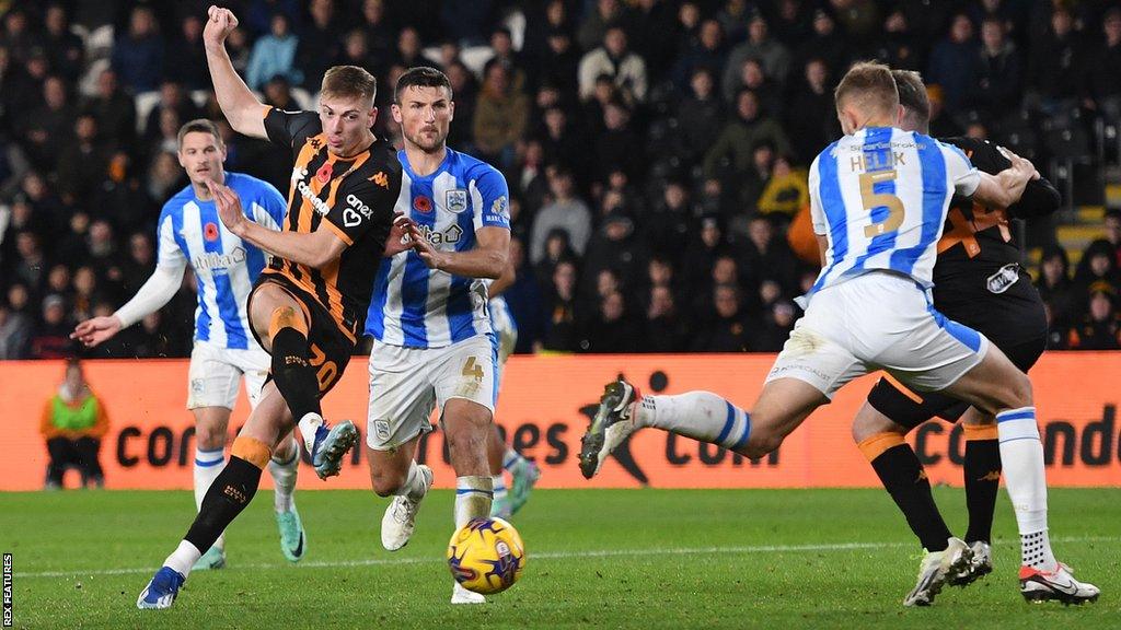 Liam Delap of Hull City scoresagainst Huddersfield Town