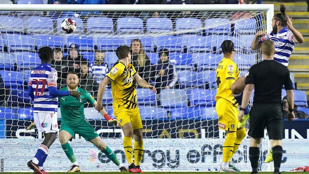 Andy Carroll heads in Reading's equaliser