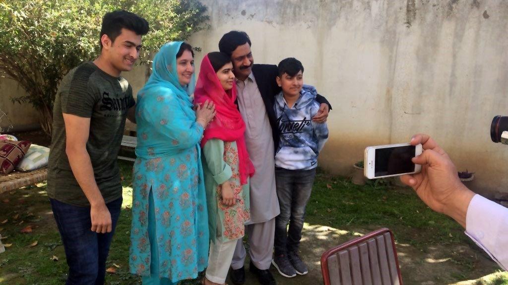 Malala (C) poses with family at their home in Mingora - 31 March