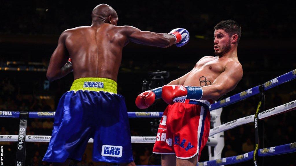 Josh Kelly dodges a punch