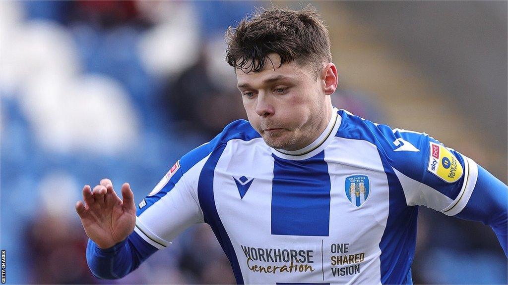 Connor Wood runs with the ball while on loan at Colchester