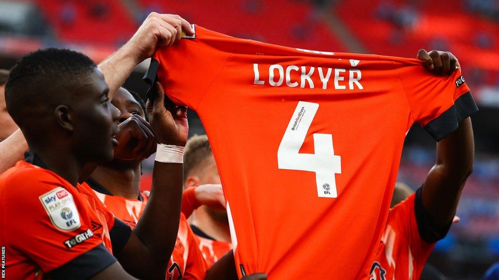 Luton sent a post-match message to Tom Lockyer by parading a replica of his shirt