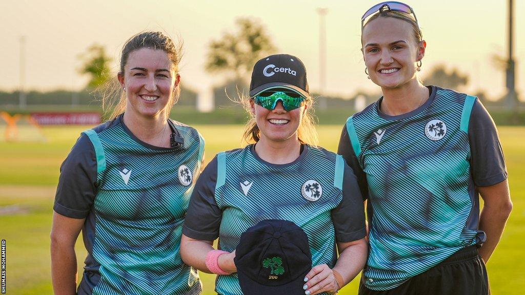 Laura Delany (centre) is handed her 200th Ireland cap by Arlene Kelly (left) and Gaby Lewis (right)