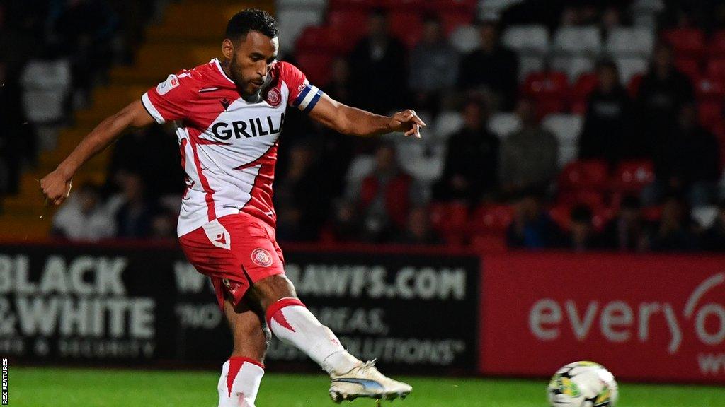 Nathan Thompson fires home Stevenage's winning penalty against Watford