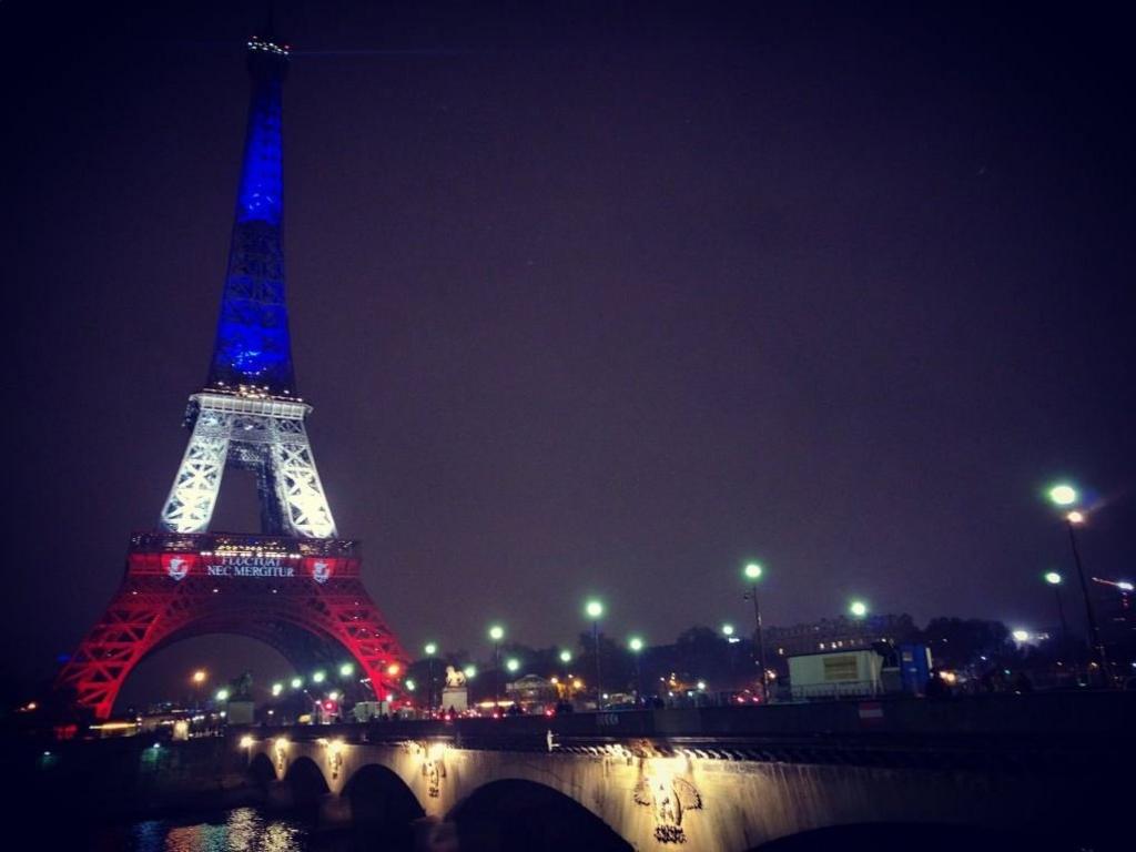 Eiffel Tower lit with the colours of France's Tricolour flag