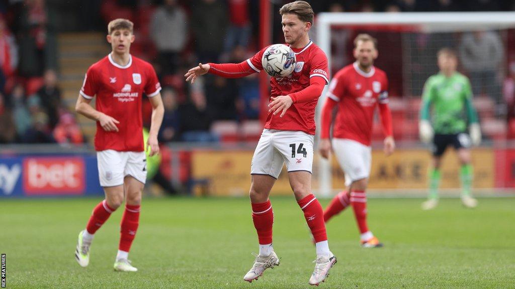 Crewe midfielder Lewis Leigh in action against AFC Wimbledon