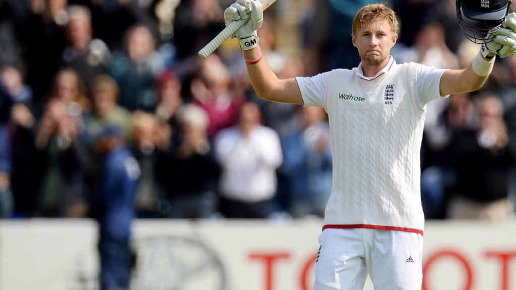 Joe Root celebrates his 100