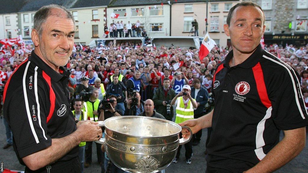 Former Tyrone manager Mickey Harte with current Red Hands joint-manager Brian Dooher after the county's All-Ireland triumph in 2008