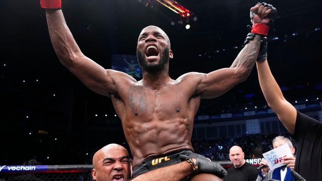 Leon Edwards celebrates beating Kamaru Usman